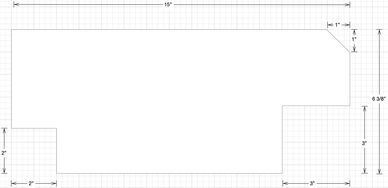 A scale diagram with dimensions listed for the lid in question. it's 15 inches by 6 3/8 inches, and has a 3 inch square cut out of one corner, a 2 inch square out of the other, and a 45 degree bevel on a third.