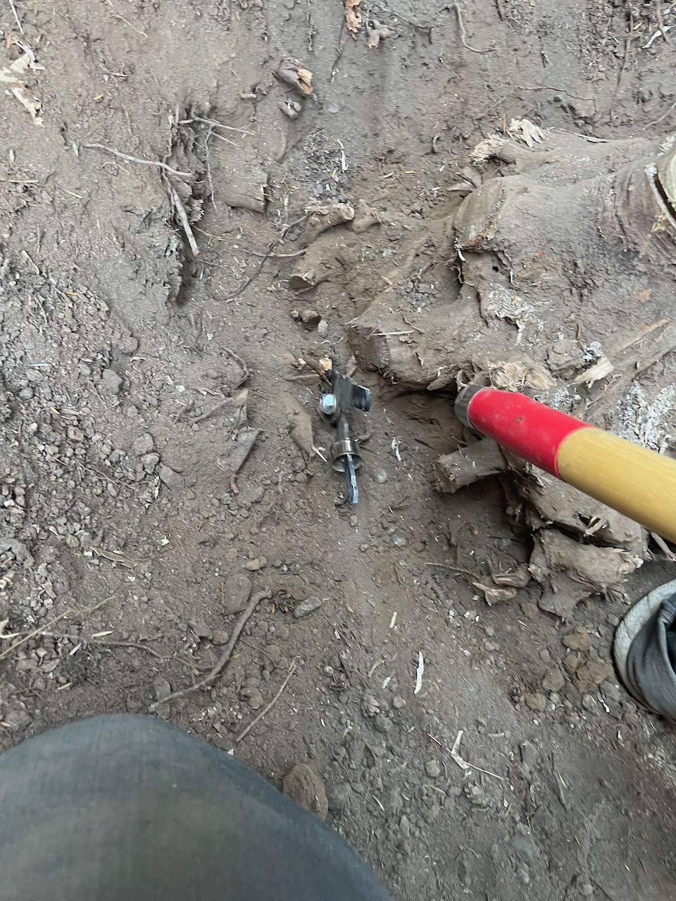 Looking back into the hole, the blade is still wedged, but the other handle has now come off, as well.